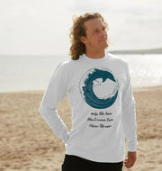 Man wearing white dolphin crewneck sweatshirt on beach